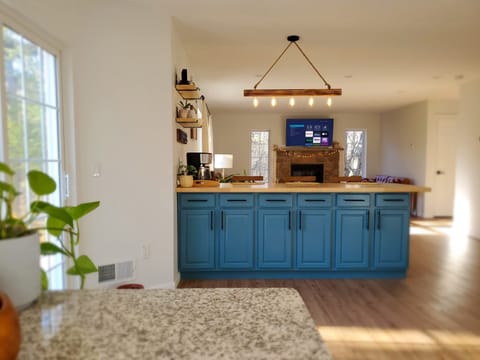 On the main floor kitchen is completely open to the living room and dining room