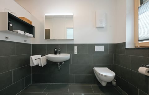 Shower, rainfall showerhead, hair dryer, towels