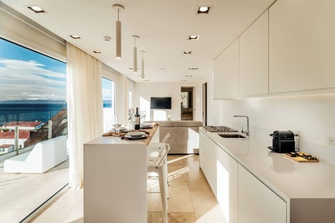 Signature Apartment | Living area | 42-inch Smart TV with cable channels, iPad, Netflix