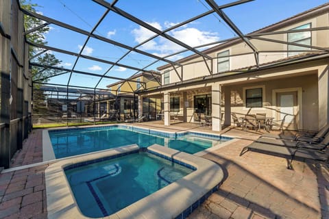 Screened-in pool & patio with loungers, perfect for sunny swims and laid-back afternoons.