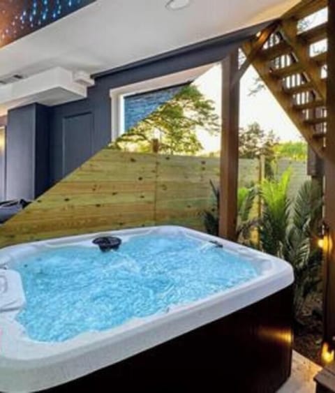 Family fun meets luxury living! Enjoy our magical movie theater and steamy 7-seater hot tub! Perfect for quality time with loved ones. Book now & create unforgettable memories in our spacious and amenity-packed home, designed for large groups!