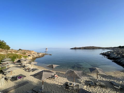 Private beach, white sand, sun loungers, beach umbrellas