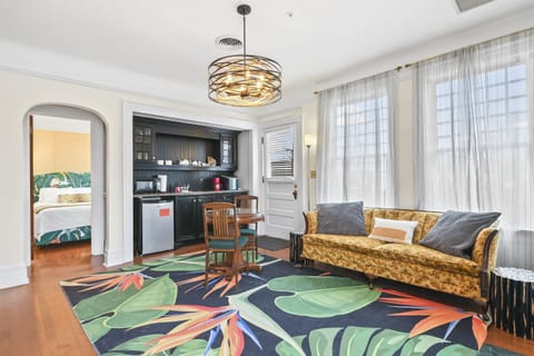 Living Room with Couch, Dining / Reading Area, and Kitchenette