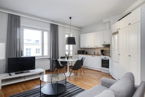Basic Apartment, City View | Living area | Flat-screen TV