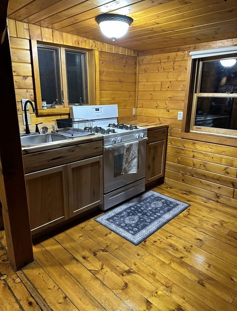 Gas stove, pots, pans, utensils,dish soap and paper towels