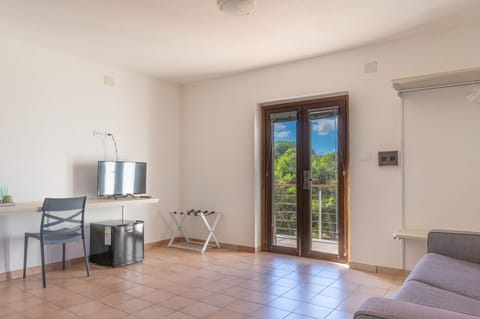 Premium bedding, desk, laptop workspace, blackout drapes