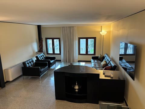 Apartment | Living area | 55-inch flat-screen TV with cable channels