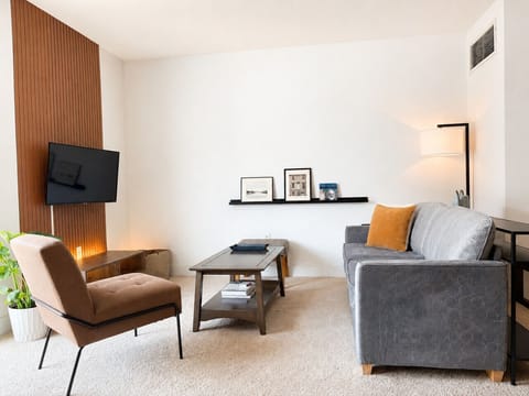 An inviting space to gather, stream your favorite shows, or simply enjoy a quiet moment on the balcony