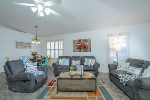 Living Room: Vibrant decor & plush seating, perfect for gathering and making memories!