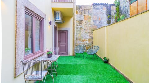 Step outside to your private patio, a tranquil spot perfect for enjoying a morning coffee or an evening drink while unwinding on the stylish outdoor seating. #PrivatePatio #OutdoorSeating #CozyEscape