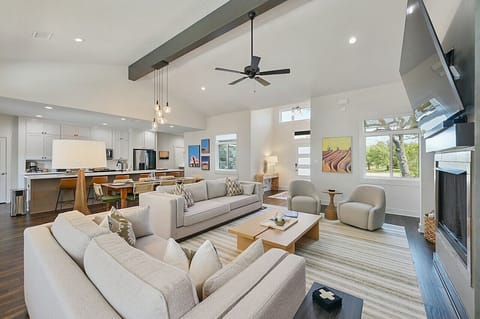 Open-concept living room design fosters spaciousness and seamless flow, perfect for gatherings and relaxation.