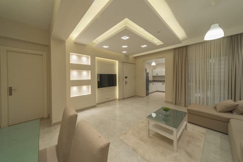 Suite | Living area | 50-inch Smart TV with satellite channels