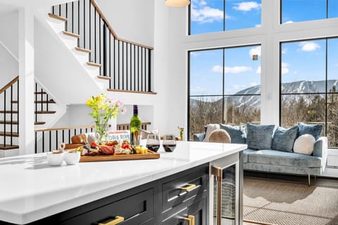 Unwind in our expansive living room, offering breathtaking views of Sunday River.