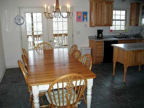 The screened porch is off the kitchen.