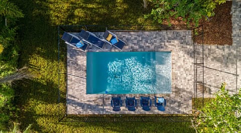 Tucked beneath the oaks, this coastal escape invites slow mornings, sun-filled swims, and easy evenings by the pool—where the unique layout gives everyone room to spread out, reconnect, and make the kind of memories that feel effortless.