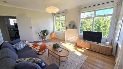 Spacious living area with a beautiful green outlook over the trees