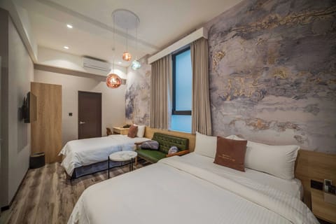 Family Triple Room | Down comforters, minibar, desk, laptop workspace