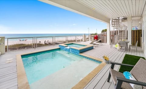 Enjoy your private pool and hot tub on this stunning beachfront deck, where crystal-clear waters meet endless ocean views.