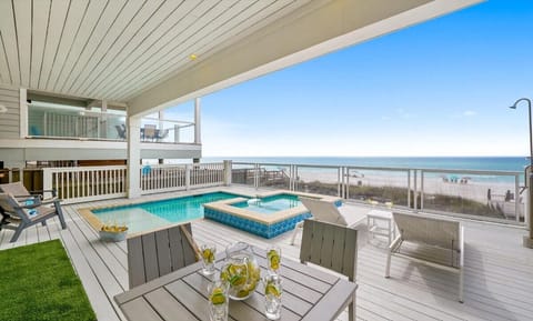 Relax on your private deck with pool, hot tub, and stunning oceanfront views stretching to the horizon.