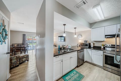 The fully equipped kitchen features granite countertops, stainless-steel appliances, and has everything you need to prepare meals for family and friends.
