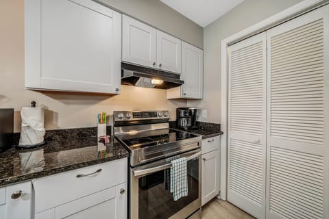 The fully equipped kitchen features granite countertops, stainless-steel appliances, and has everything you need to prepare meals for family and friends.