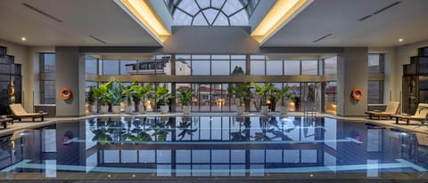 Indoor pool, pool umbrellas, sun loungers