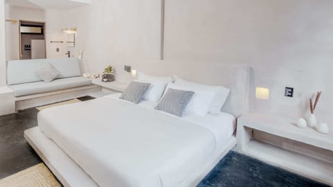 Step into spacious luxury in the master bedroom, featuring a king-size bed dressed in premium linens. Refresh yourself in the private bathroom with a modern shower, then relax in perfect comfort with air conditioning and gentle ceiling vents designed