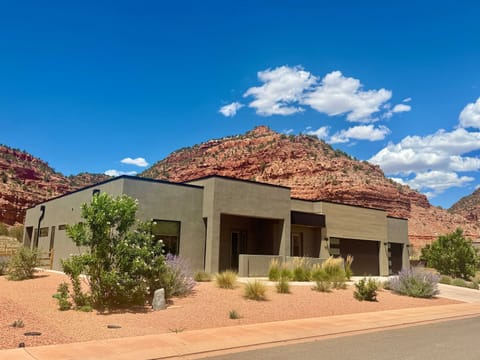 Desert Willow backs up to a canyon, providing stunning views, opportunities to see deer and other wildlife from the rooftop deck, and hiking options right from your doorstep!