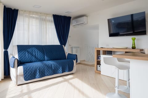 Panoramic Villa | Living area | 50-inch flat-screen TV with digital channels