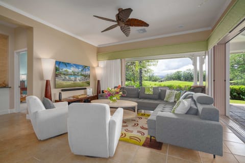 The family room with large sliding doors that open up to the lanai and back yard.