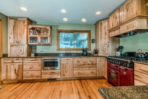 Spacious, open kitchen featuring gorgeous cabinets and granite countertops