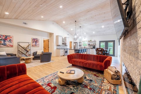 Cozy living area with fireplace, smart TV, and stylish seating for relaxing