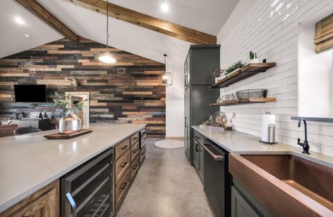 Kitchen stocked with essentials - salt, pepper, sugar, oil, variety of seasoning