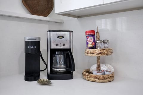 Fuel your day with our fully stocked kitchen, complete with all the essentials and a little extra love – including your choice of a classic drip coffee pot or a convenient single cup coffee maker. Because mornings are better with the perfect brew, and we've got you covered! ☕🍳 #KitchenPerfection #CoffeeLoversDream #TybeeIsland #LuxuryVacation #BeachRetreat #WesterlyGuild #Anchoredon8