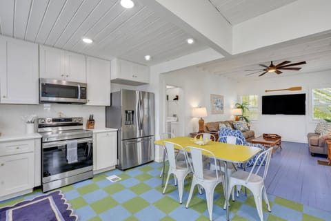 Dive into the heart of our home where the kitchen spills seamlessly into the living room, boasting playful blue and green floors that add a splash of personality to every step. Get ready to cook, laugh, and make memories in this vibrant space where comfort meets creativity. 🍳💙💚 #OpenConceptCharm #ColorfulLiving #HomeSweetHome #TybeeIsland #LuxuryVacation #BeachRetreat #Weste...