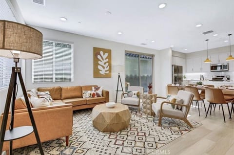 Open floor plan living room area, dining and kitchen area