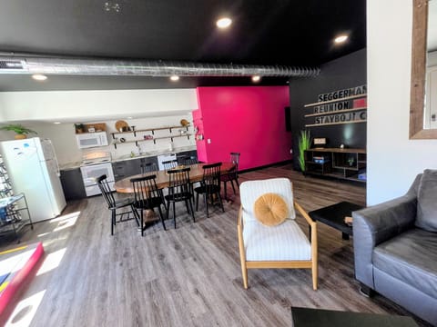 The living area is designed for relaxation and socializing, boasting ample seating and a cozy atmosphere. 