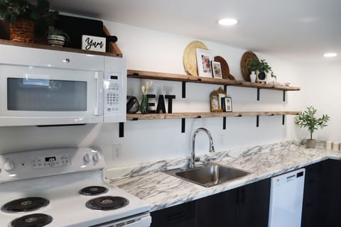  Whip up delicious meals in the fully equipped kitchen, complete with modern appliances and plenty of counter space for meal prep.