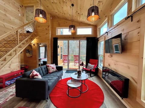 Cozy living room with fireplace and TV.
