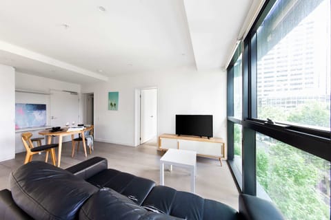 A modern living area with a 3-seater couch.