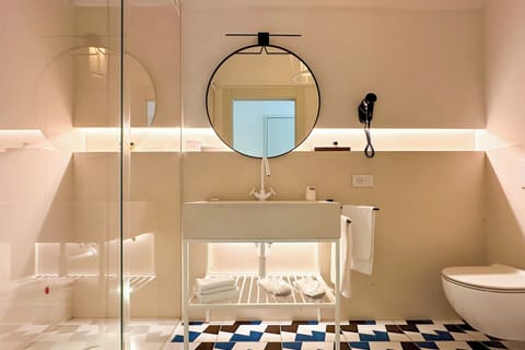 Superior Room | Bathroom | Rainfall showerhead, hair dryer, bathrobes, slippers