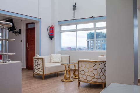 Executive Studio Suite, Garden View | Living area | 42-inch Smart TV with cable channels