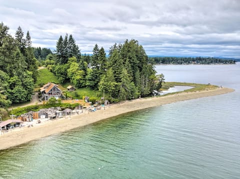 The beach to the right of the property is a State Park accessible only by boat.