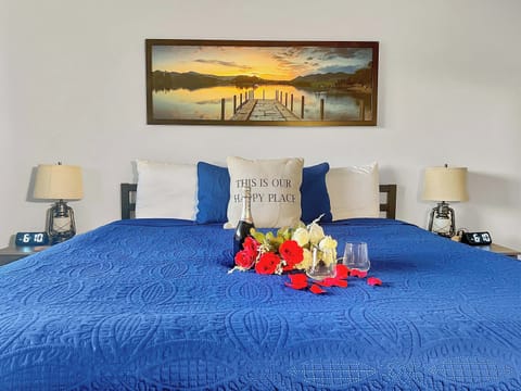 King bed ready for a comfy nights rest or a romantic evening with that special person in your life.