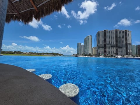 Outdoor pool, pool umbrellas, sun loungers