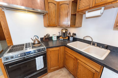 Kitchen with coffee maker, tea kettle, and toaster near Silverwood Theme Park.