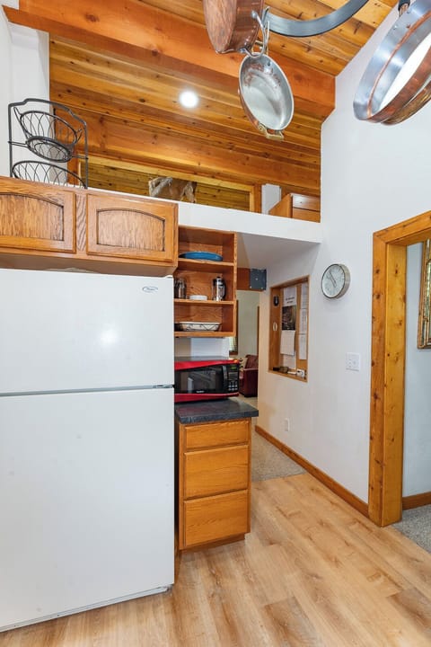 Kitchen with fridge, microwave, and French press near Silverwood Theme Park.