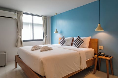 Deluxe King | Premium bedding, individually decorated, desk, laptop workspace
