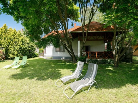 Plant, Property, Tree, Nature, Building, Shade, Natural Landscape, Sky, Outdoor Furniture, Land Lot