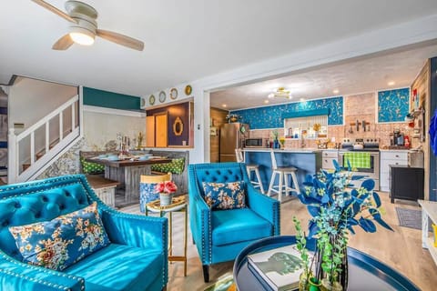 [Lounge, Downstairs] Just in front of you is a fireplace, radiating warmth and charm.